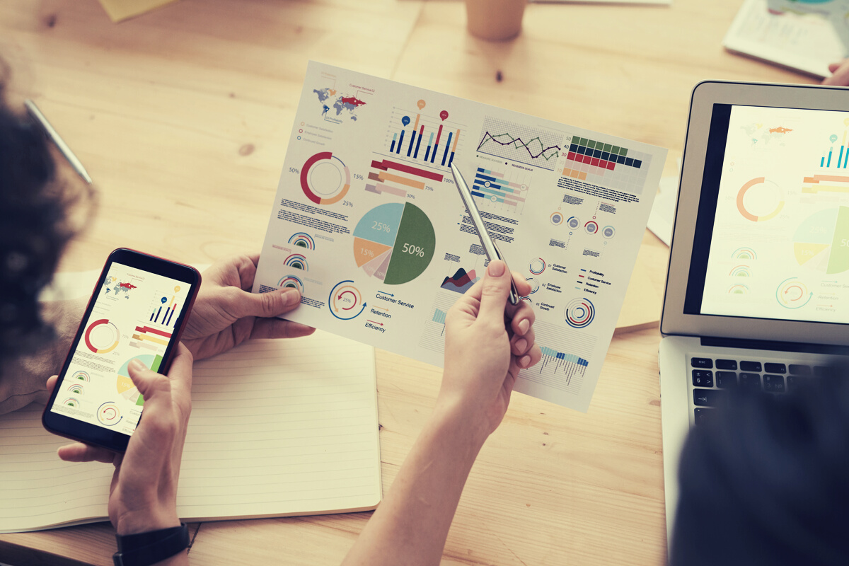 Colleagues Looking at Survey Sheet